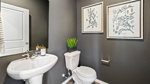 Half bathroom in the open concept living space.