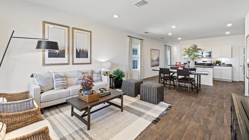 Open floor plan of the living, kitchen, and dining area.