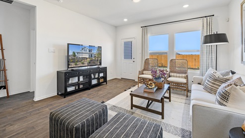Spacious living area with large windows for natural lighting.