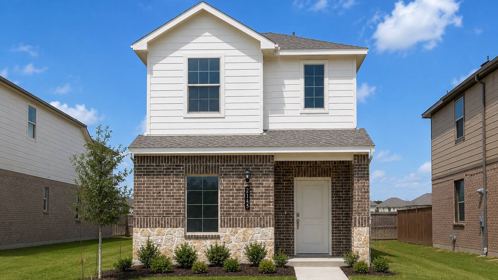 exterior two-story brick house in Arlington, Texas.