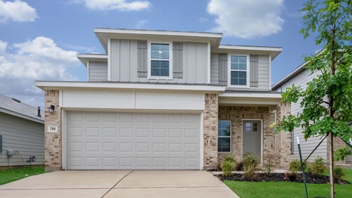 Front exterior two story home with a two-car garage and driveway in the front.