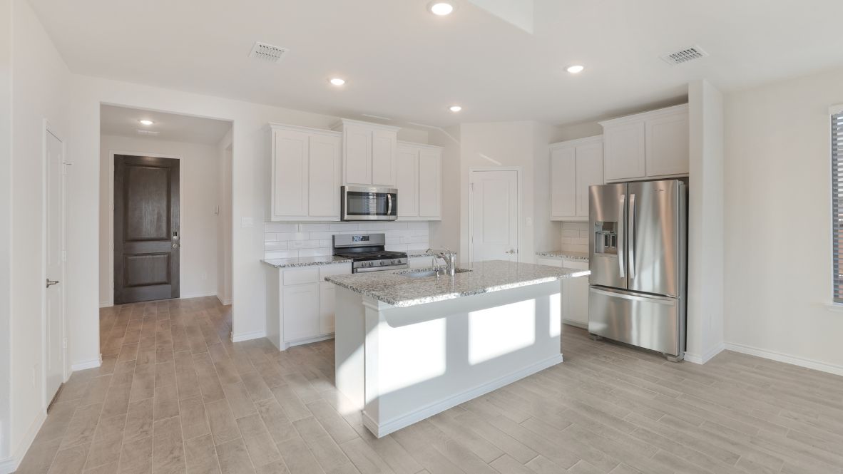Spacious open-concept kitchen with a central island