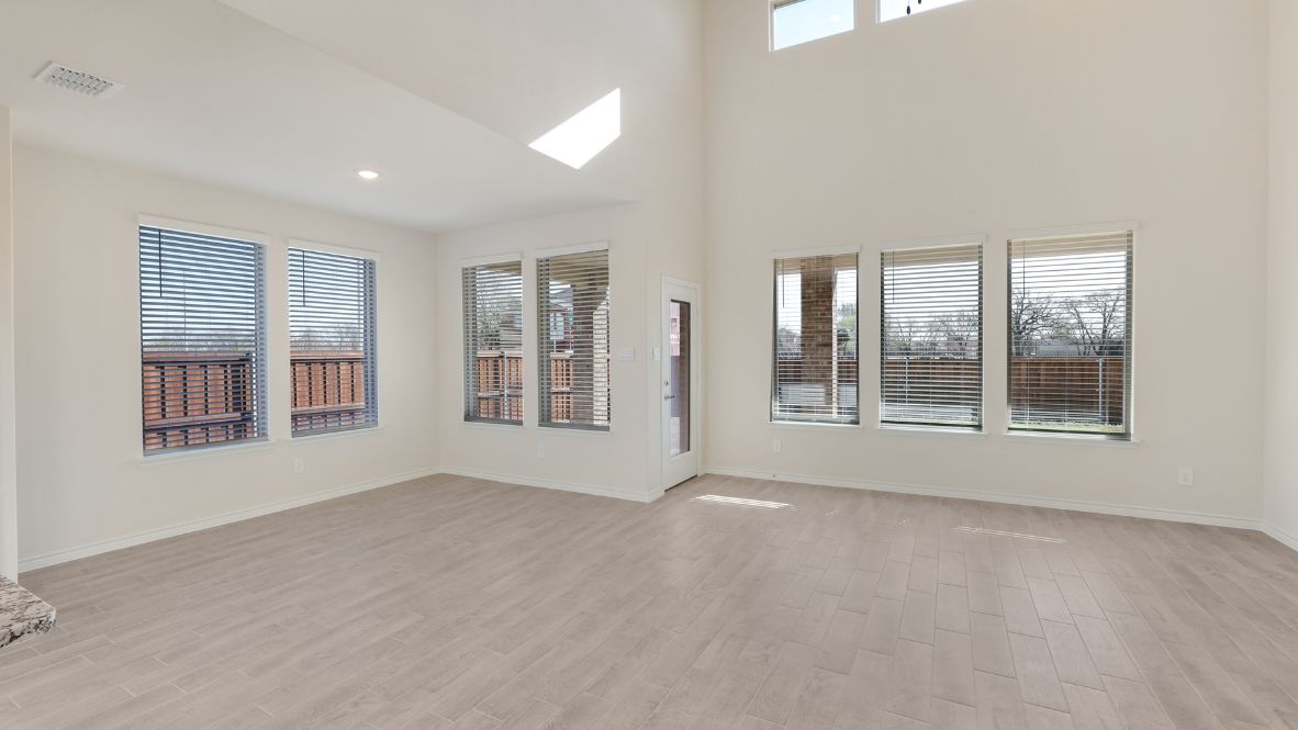 spacious open-concept living room and family room with lots of windows and natural light