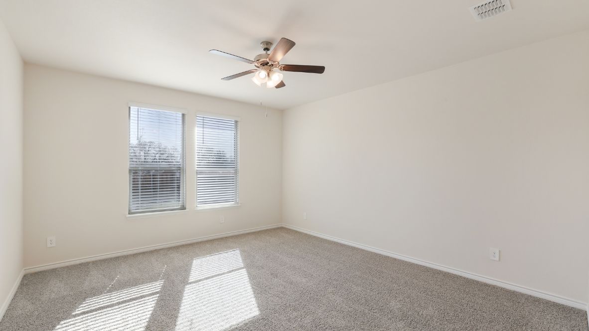 bedroom with windows and plush carpet with a celing fan