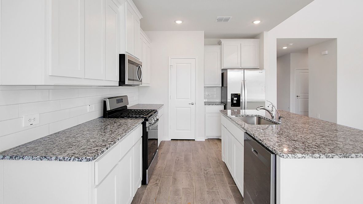 kitchen with granite counter tops and stainless steel appliances