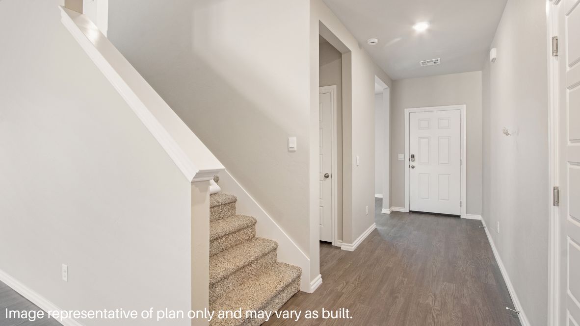 Returning to the stairway by the foyer and journeying up the stairs, you arrive in the carpeted game room. This room has carpet flooring and can serve as a movie room or playroom. The entry for the attic is located in the hallway.