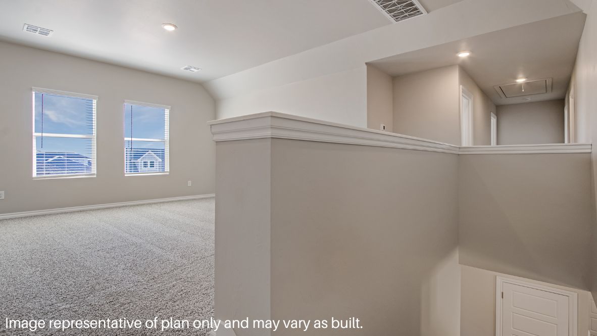 Returning to the stairway by the foyer and journeying up the stairs, you arrive in the carpeted game room. This room has carpet flooring and can serve as a movie room or playroom. The entry for the attic is located in the hallway.