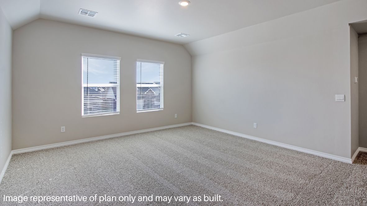Returning to the stairway by the foyer and journeying up the stairs, you arrive in the carpeted game room. This room has carpet flooring and can serve as a movie room or playroom. The entry for the attic is located in the hallway.