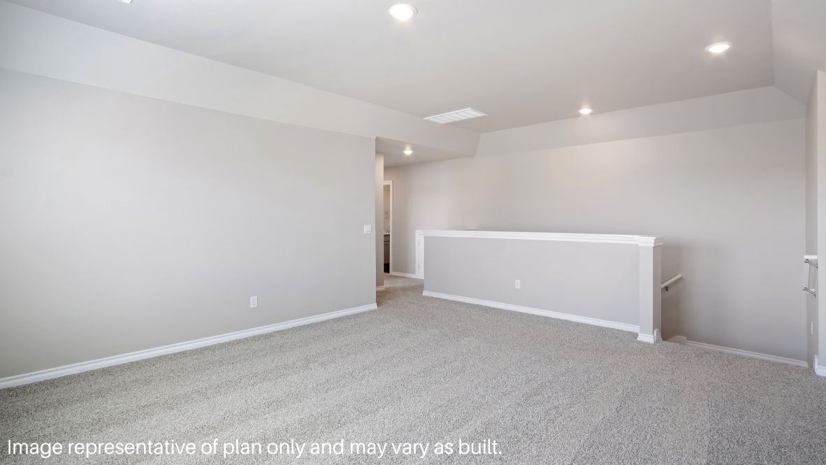 Returning to the stairway by the foyer and journeying up the stairs, you arrive in the carpeted game room. This room has carpet flooring and can serve as a movie room or playroom. The entry for the attic is located in the hallway.
