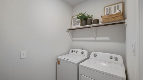 laundry room with side by side washer and dryer