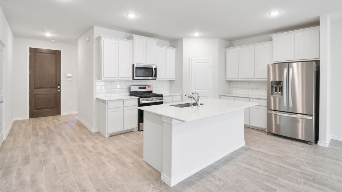 Spacious, bright, well lit kitchen with granite countertops