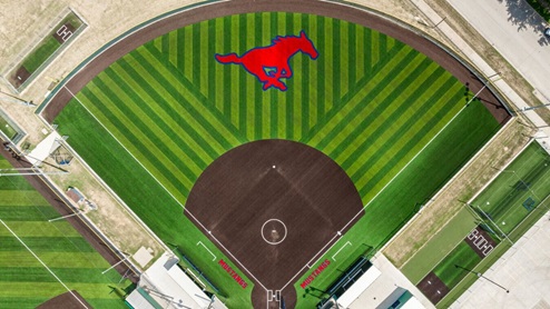 Wide shot of JJ Pearce High School campus in Richardson, TX, showing athletic fields