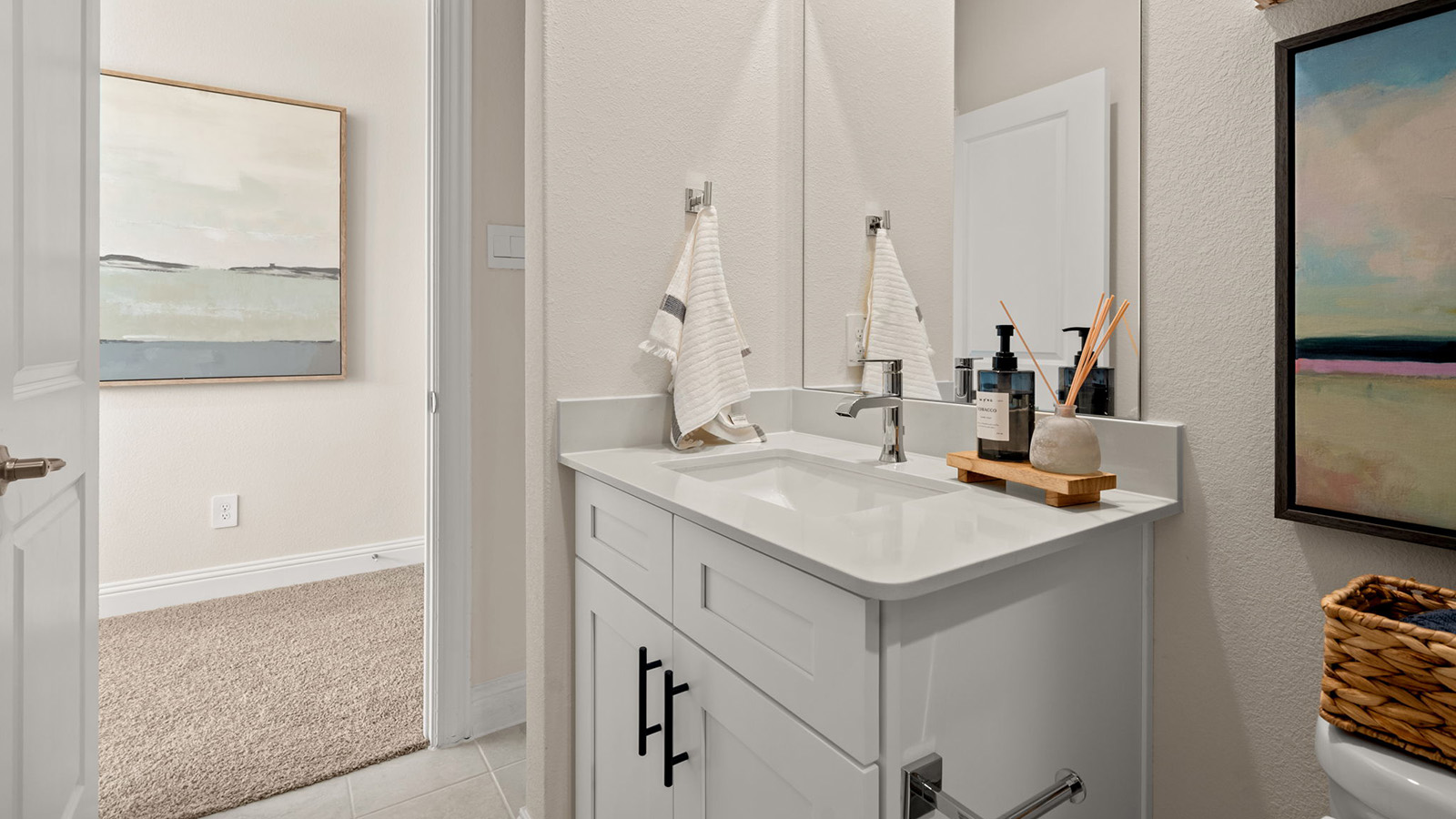 Secondary bathroom with white vanity