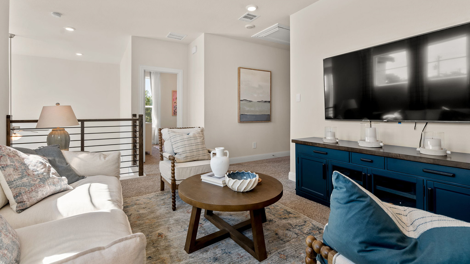 Upstairs loft area with chairs and tv
