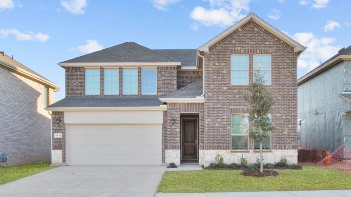 Two-story Ozark floor plan featuring 4 bedrooms, 3 bathrooms, and a spacious game room. The home showcases a welcoming front porch