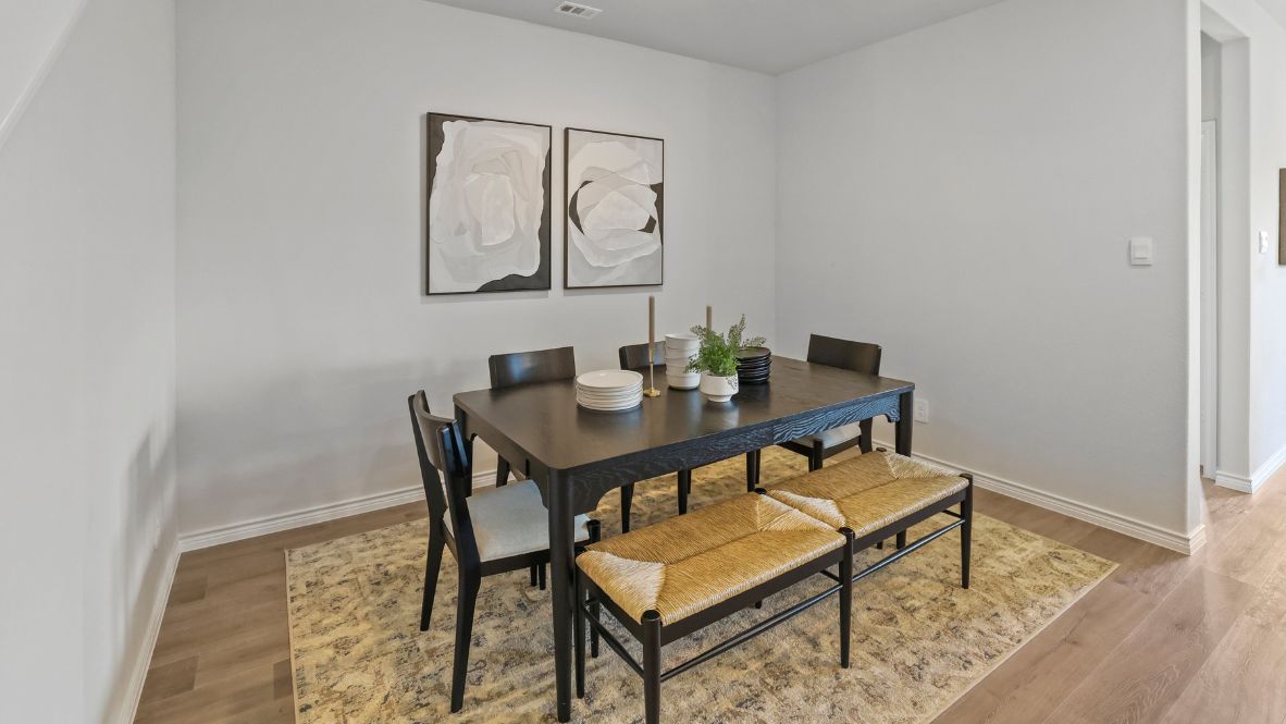 Welcome to the Ozark, the perfect family home where comfort, style, and fun meet! This spacious two-story home offers 2,577 sq. ft. of living space, including 4 bedrooms and 3 bathrooms, designed with family living in mind. As you approach the home, you'll be greeted by a charming elongated front porch that leads into a welcoming foyer. Just off the foyer, you'll find a cozy secondary bedroom and bath, perfect for guests or as a private home office, plus a convenient tiled utility room.  The heart of the home is the open, bright kitchen that flows seamlessly into the family living area. Imagine cooking in your gorgeous kitchen, complete with spacious quartz countertops, classic white 4x16 subway tile backsplash, stainless steel appliances, and a large kitchen island with a deep, single-bowl sink. The walk-in corner pantry provides plenty of space to store your essentials. The adjoining dining area is perfect for family meals and entertaining friends.  Retreat to the main bedroom located privately at the back of the home. It features a luxurious ensuite with double vanity sinks, a huge walk-in closet, and a large walk-in shower with glossy white 10x14 subway tile surround.  Upstairs, you'll find a family-friendly movie room, ideal for cozy nights with the kids, holiday movie marathons, or simply enjoying quality time together. The game room leads to two more guest bedrooms and a third full bathroom.  Enjoy outdoor family gatherings with a covered rear patio (per plan) and a professionally landscaped yard. The Ozark also comes with smart home technology through our HOME IS CONNECTED base package, so you can control the lights, thermostat, and locks right from your phone.  Ready to find your dream family home? Call today to schedule a tour of the Ozark and see how it’s designed for family fun and comfort!