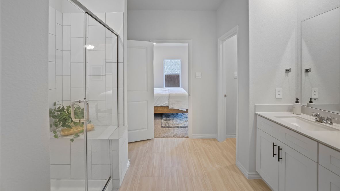 Welcome to the Ozark, the perfect family home where comfort, style, and fun meet! This spacious two-story home offers 2,577 sq. ft. of living space, including 4 bedrooms and 3 bathrooms, designed with family living in mind. As you approach the home, you'll be greeted by a charming elongated front porch that leads into a welcoming foyer. Just off the foyer, you'll find a cozy secondary bedroom and bath, perfect for guests or as a private home office, plus a convenient tiled utility room.  The heart of the home is the open, bright kitchen that flows seamlessly into the family living area. Imagine cooking in your gorgeous kitchen, complete with spacious quartz countertops, classic white 4x16 subway tile backsplash, stainless steel appliances, and a large kitchen island with a deep, single-bowl sink. The walk-in corner pantry provides plenty of space to store your essentials. The adjoining dining area is perfect for family meals and entertaining friends.  Retreat to the main bedroom located privately at the back of the home. It features a luxurious ensuite with double vanity sinks, a huge walk-in closet, and a large walk-in shower with glossy white 10x14 subway tile surround.  Upstairs, you'll find a family-friendly movie room, ideal for cozy nights with the kids, holiday movie marathons, or simply enjoying quality time together. The game room leads to two more guest bedrooms and a third full bathroom.  Enjoy outdoor family gatherings with a covered rear patio (per plan) and a professionally landscaped yard. The Ozark also comes with smart home technology through our HOME IS CONNECTED base package, so you can control the lights, thermostat, and locks right from your phone.  Ready to find your dream family home? Call today to schedule a tour of the Ozark and see how it’s designed for family fun and comfort!