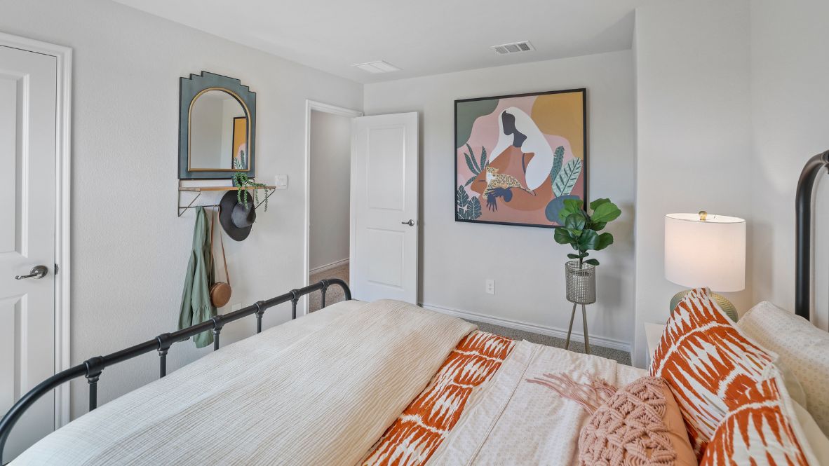 Welcome to the Ozark, the perfect family home where comfort, style, and fun meet! This spacious two-story home offers 2,577 sq. ft. of living space, including 4 bedrooms and 3 bathrooms, designed with family living in mind. As you approach the home, you'll be greeted by a charming elongated front porch that leads into a welcoming foyer. Just off the foyer, you'll find a cozy secondary bedroom and bath, perfect for guests or as a private home office, plus a convenient tiled utility room.  The heart of the home is the open, bright kitchen that flows seamlessly into the family living area. Imagine cooking in your gorgeous kitchen, complete with spacious quartz countertops, classic white 4x16 subway tile backsplash, stainless steel appliances, and a large kitchen island with a deep, single-bowl sink. The walk-in corner pantry provides plenty of space to store your essentials. The adjoining dining area is perfect for family meals and entertaining friends.  Retreat to the main bedroom located privately at the back of the home. It features a luxurious ensuite with double vanity sinks, a huge walk-in closet, and a large walk-in shower with glossy white 10x14 subway tile surround.  Upstairs, you'll find a family-friendly movie room, ideal for cozy nights with the kids, holiday movie marathons, or simply enjoying quality time together. The game room leads to two more guest bedrooms and a third full bathroom.  Enjoy outdoor family gatherings with a covered rear patio (per plan) and a professionally landscaped yard. The Ozark also comes with smart home technology through our HOME IS CONNECTED base package, so you can control the lights, thermostat, and locks right from your phone.  Ready to find your dream family home? Call today to schedule a tour of the Ozark and see how it’s designed for family fun and comfort!