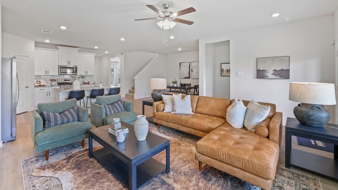 Welcome to the Ozark, the perfect family home where comfort, style, and fun meet! This spacious two-story home offers 2,577 sq. ft. of living space, including 4 bedrooms and 3 bathrooms, designed with family living in mind. As you approach the home, you'll be greeted by a charming elongated front porch that leads into a welcoming foyer. Just off the foyer, you'll find a cozy secondary bedroom and bath, perfect for guests or as a private home office, plus a convenient tiled utility room.  The heart of the home is the open, bright kitchen that flows seamlessly into the family living area. Imagine cooking in your gorgeous kitchen, complete with spacious quartz countertops, classic white 4x16 subway tile backsplash, stainless steel appliances, and a large kitchen island with a deep, single-bowl sink. The walk-in corner pantry provides plenty of space to store your essentials. The adjoining dining area is perfect for family meals and entertaining friends.  Retreat to the main bedroom located privately at the back of the home. It features a luxurious ensuite with double vanity sinks, a huge walk-in closet, and a large walk-in shower with glossy white 10x14 subway tile surround.  Upstairs, you'll find a family-friendly movie room, ideal for cozy nights with the kids, holiday movie marathons, or simply enjoying quality time together. The game room leads to two more guest bedrooms and a third full bathroom.  Enjoy outdoor family gatherings with a covered rear patio (per plan) and a professionally landscaped yard. The Ozark also comes with smart home technology through our HOME IS CONNECTED base package, so you can control the lights, thermostat, and locks right from your phone.  Ready to find your dream family home? Call today to schedule a tour of the Ozark and see how it’s designed for family fun and comfort!