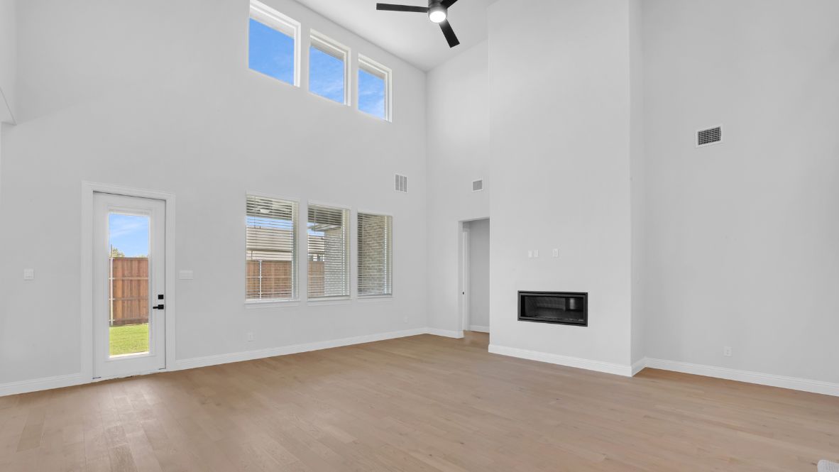 Living room featuring a fireplace and large windows.