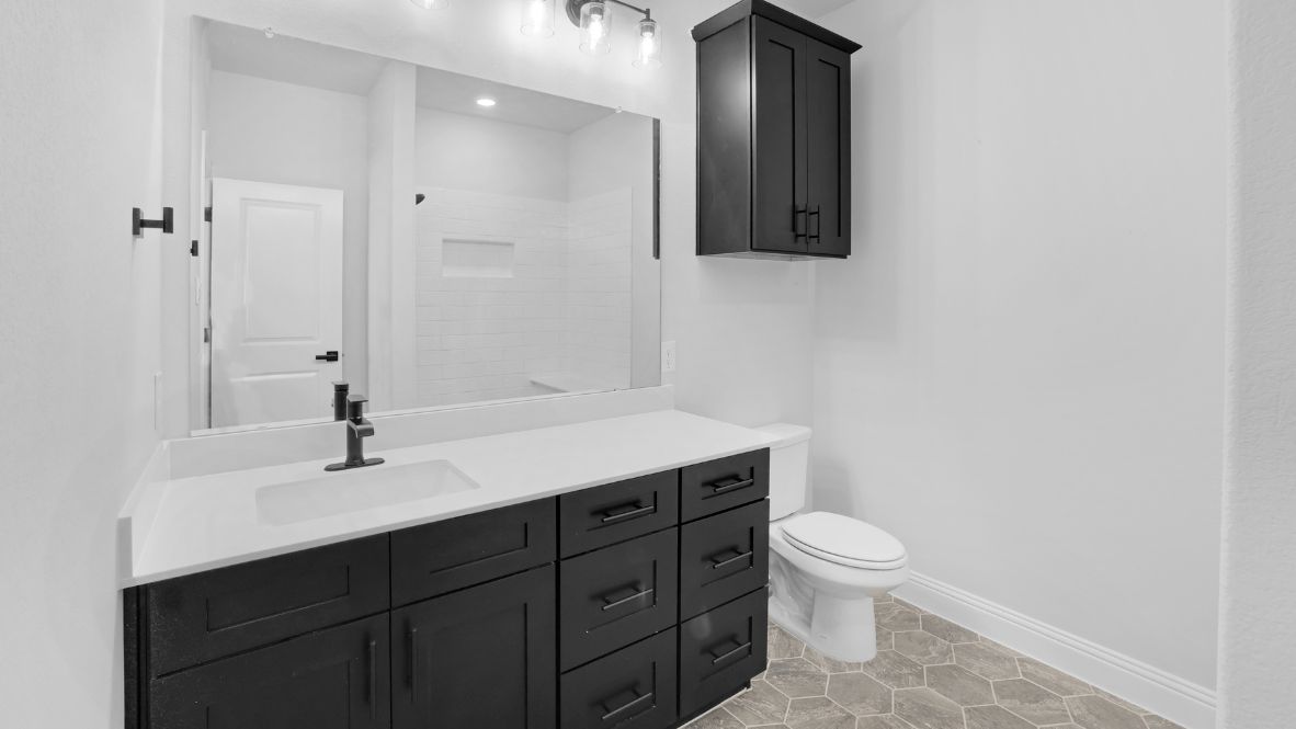 Bathroom with a sink, toilet, and shower tub.