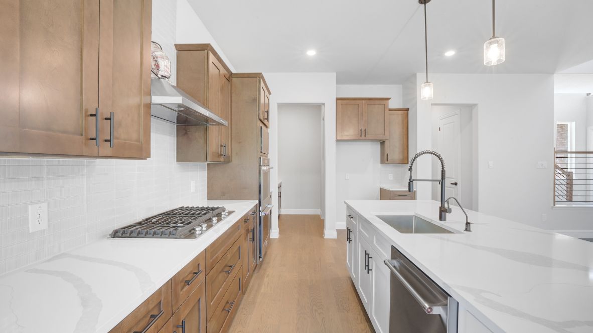 Every detail of this D.R. Horton Emerald Series 4 bedroom/3.5 bath home is thoughtfully designed to enhance the modern lifestyle and daily routine of its homeowners. Beyond a functional entryway space, the home flows into a luminous open-concept living, dining, kitchen area. This expansive area is truly the “heart of the home.” The gourmet kitchen features 3cm Quartz countertops, Kitchen Aid stainless steel appliances, double ovens, microwave, and a five-burner gas cooktop. A spacious walk-in pantry and Butler’s pantry are nearby for convenient storage and organization. One of the best features of this striking home design is the covered outdoor living/ entertaining area, located just outside of the Kitchen/Family Room. The owner’s retreat includes a 15ft x16ft bedroom space, a primary bathroom with double vanities, a stand-alone bathtub, 42”x 60” shower with bench, and an oversized walk-in closet. Also on the first level of the home is a private study. In addition to the three bedrooms and two baths upstairs, this home offers a pre-wired media room as well as a versatile game room for recreation and relaxation. Northside Place is an exceptional new home community. Only 24 homesites are available! Come take advantage of this rare opportunity to purchase new construction in the heart of the Metroplex!