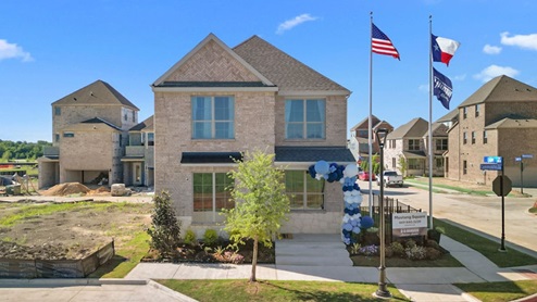 Exterior two-story home with stone detailing