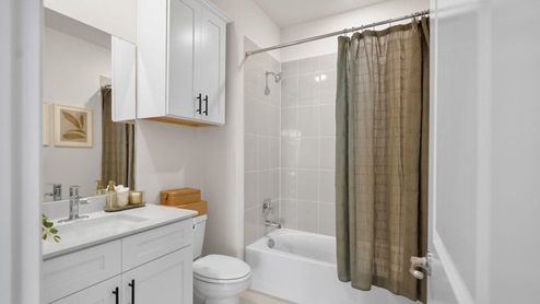 Interior bathroom with full-sized shower and sink