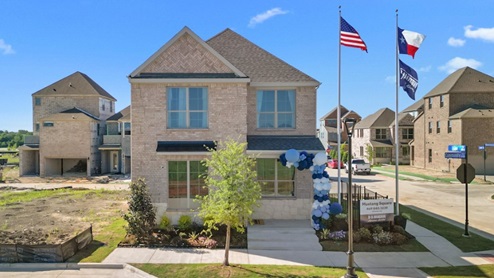 Exterior two-story home with stone detailing