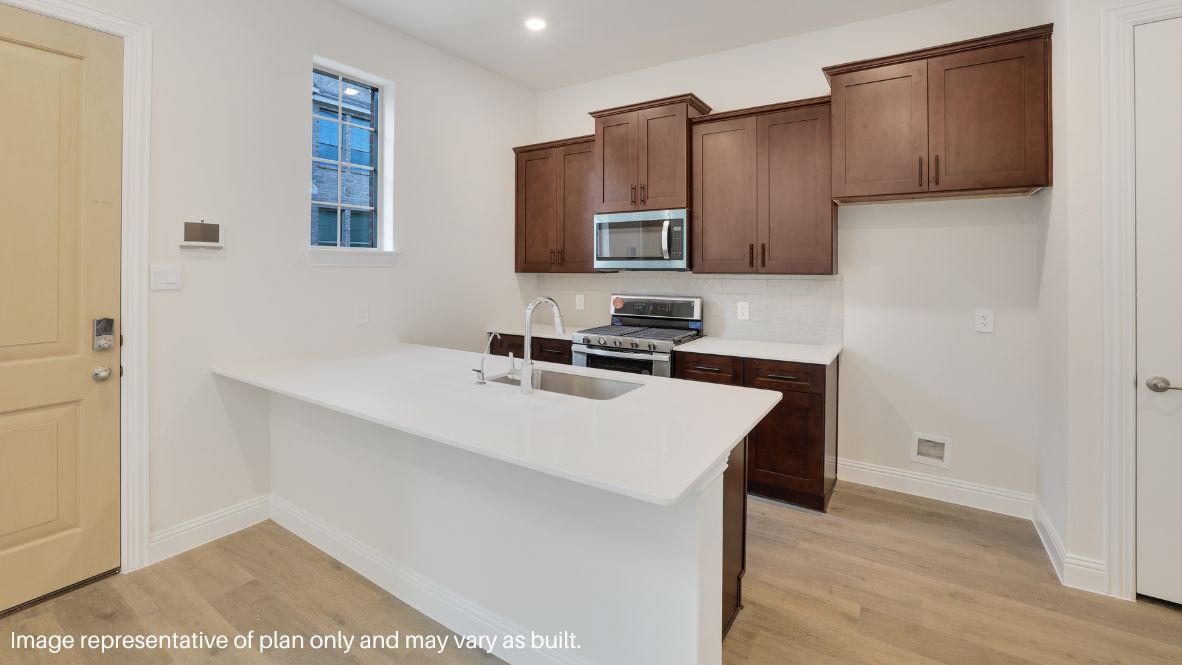 Step inside and be greeted by an open-concept living space, where natural light pours through large windows, enhancing the sleek picture-frame cabinetry, stainless steel appliances, and quartz or granite countertops in the chef-inspired kitchen.