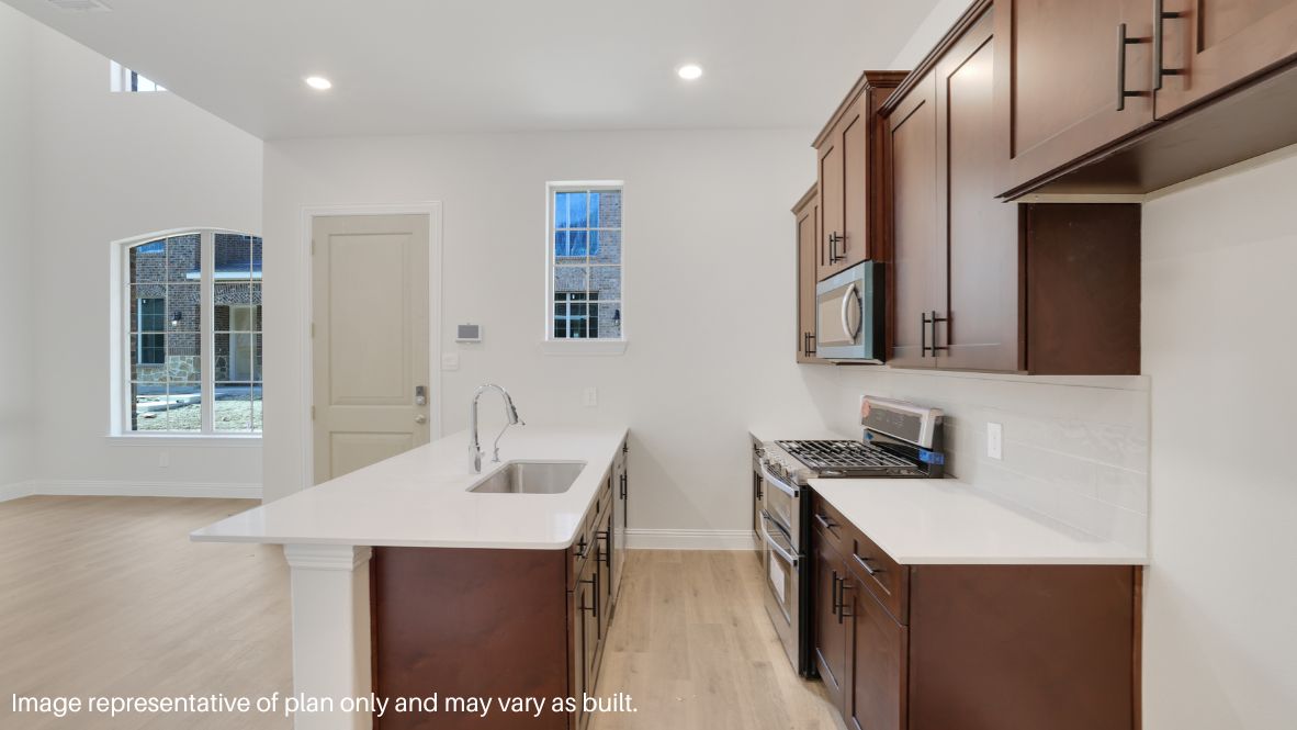 Step inside and be greeted by an open-concept living space, where natural light pours through large windows, enhancing the sleek picture-frame cabinetry, stainless steel appliances, and quartz or granite countertops in the chef-inspired kitchen.