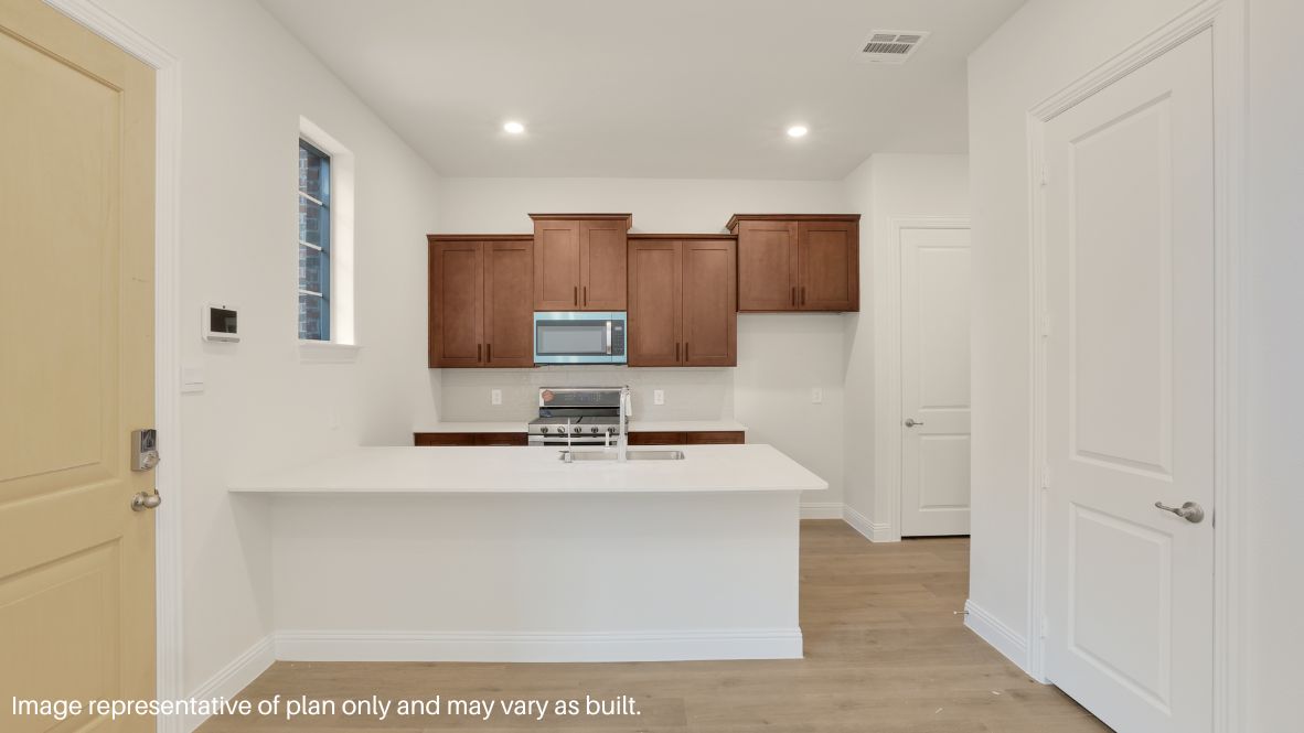 Step inside and be greeted by an open-concept living space, where natural light pours through large windows, enhancing the sleek picture-frame cabinetry, stainless steel appliances, and quartz or granite countertops in the chef-inspired kitchen.