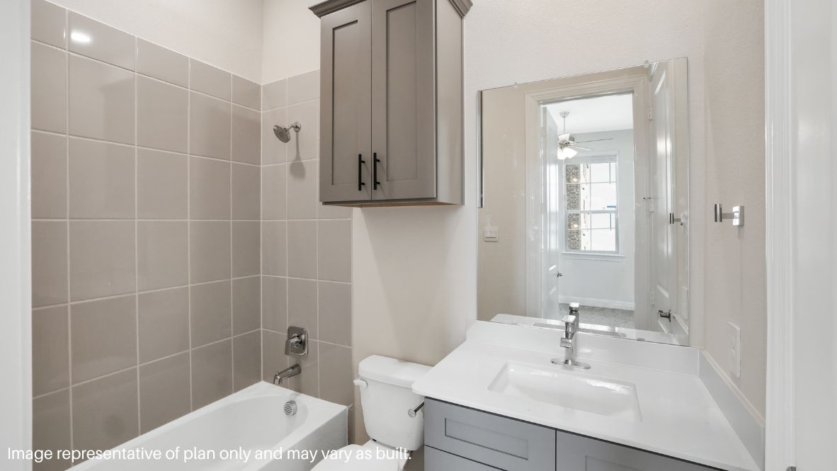 The main-floor bedroom with an en-suite bath is perfect for guests