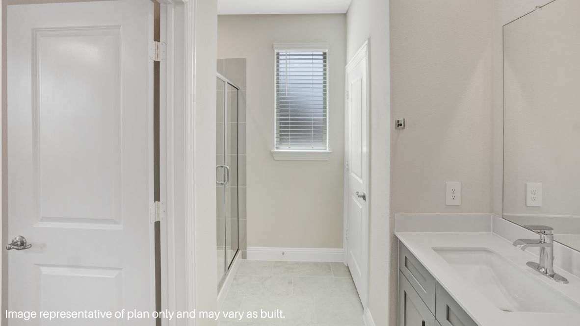 while the second level features a spacious primary suite with a walk-in closet, dual vanity bath, and two additional bedrooms.