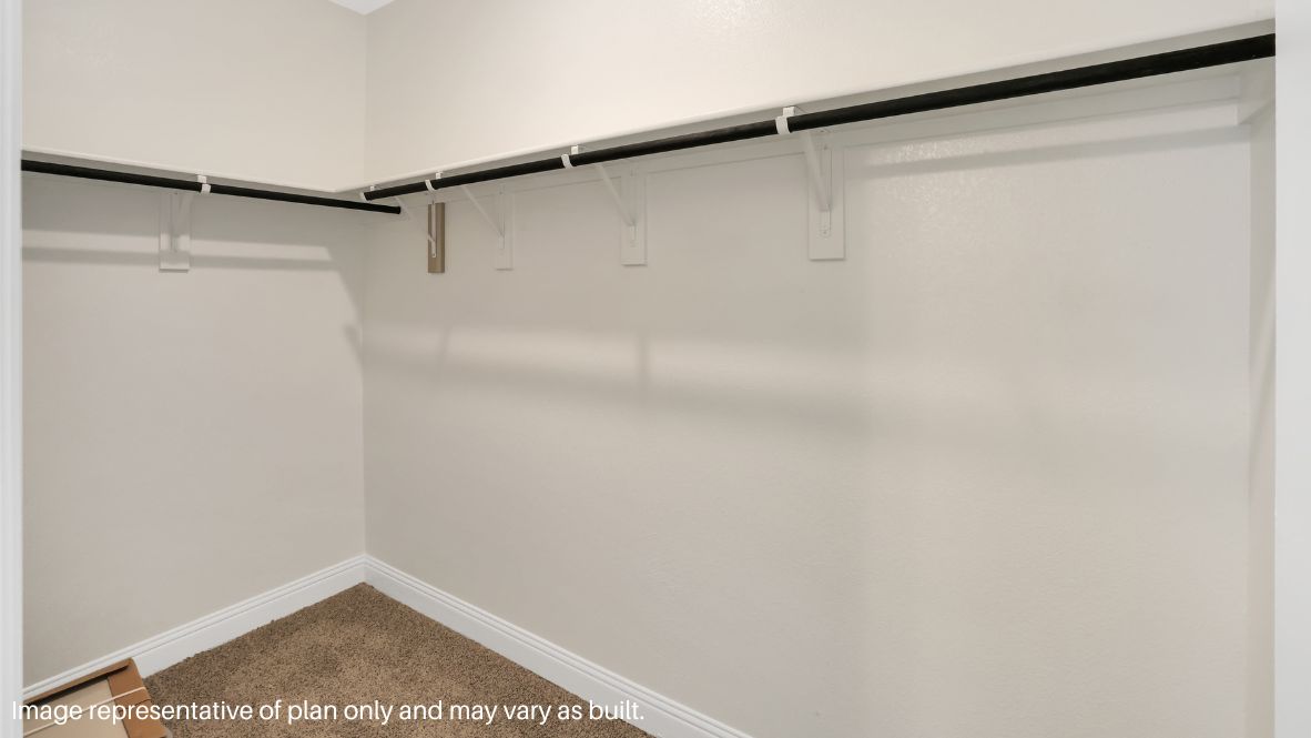 while the second level features a spacious primary suite with a walk-in closet, dual vanity bath, and two additional bedrooms.