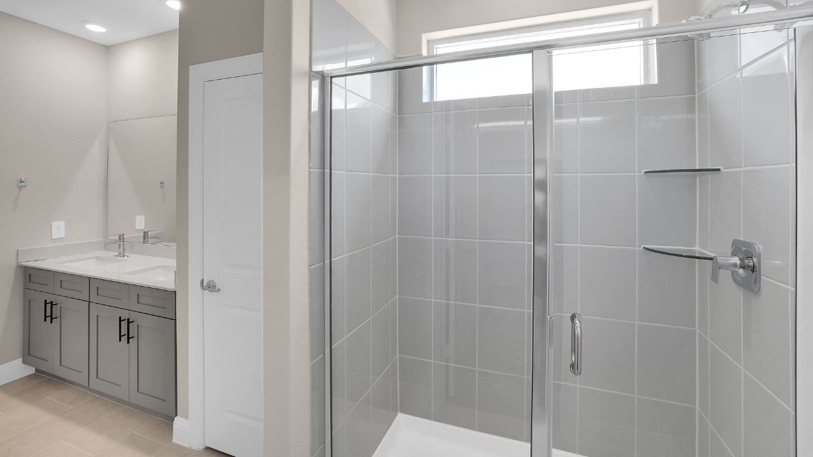 Spacious bathroom with walk in shower and hard surface flooring.