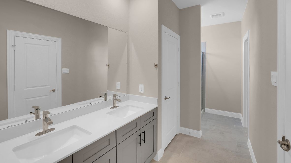 Spacious bathroom with walk in shower and hard surface flooring.