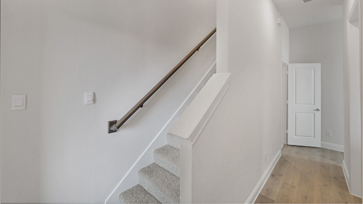 carpeted stairs leading upstairs