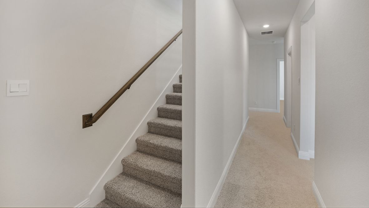 carpeted stairs leading upstairs