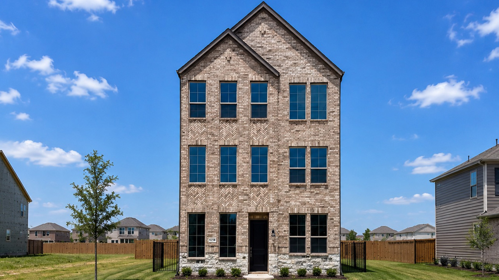 modern three-story brick house in allen, texas