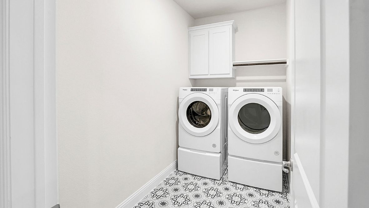 Laundry room located right off the primary bedroom.