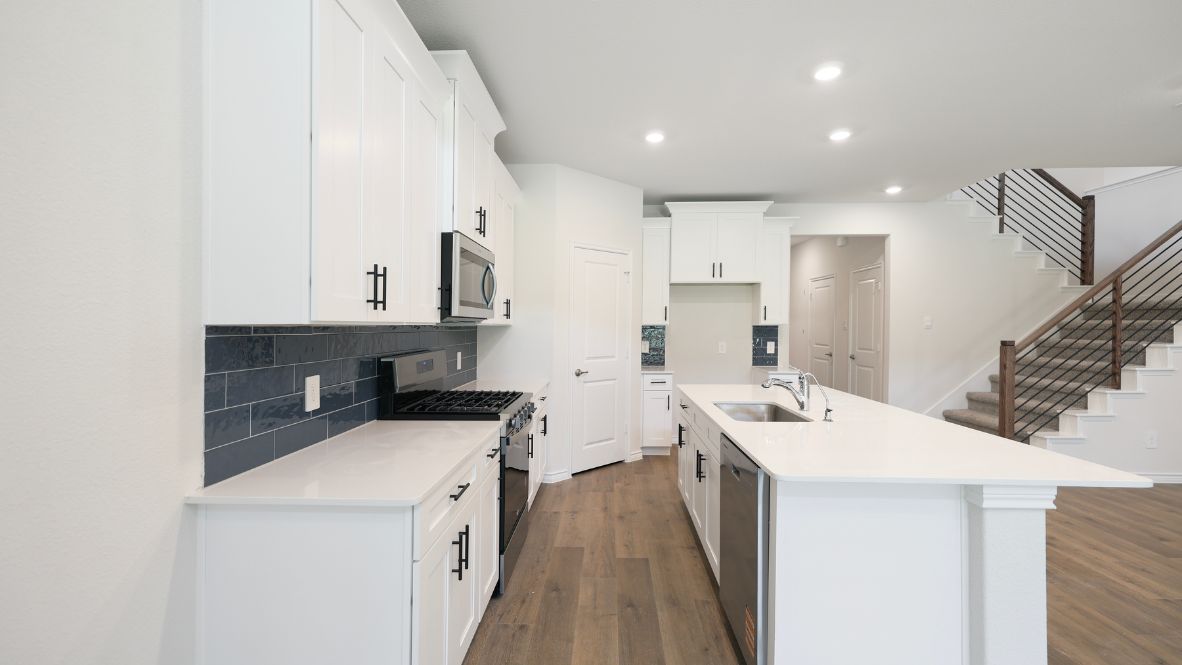 The Burrow is one of our two-story floorplans featured at our Hidden Lakes community in McKinney, TX. The Burrow offers an impressive 2,560 sq. ft. of living space across 4 bedrooms, 3 bathrooms, and a 2-car garage.  As you walk through the long foyer to the open layout of the home, you will find the large kitchen that is open to the spacious family room and dining area. The soaring ceilings in the living room are sure to grab your attention. The kitchen features granite or quartz countertops, decorative tile backsplash, stainless steel appliances and a large kitchen island.  The main bedroom, bedroom 1, is located downstairs and features a large walk in shower and huge walk in closet. Upstairs you will find a large loft that is open to the living room below. Utilize this space as a media room, game room, or home gym.  This home comes included with a professionally designed landscape package and a full irrigation system as well as our Home is Connected® base package that offers devices such as offers devices such as the Amazon Echo Pop, a Video Doorbell, Deako Smart Light Switch, a Honeywell Thermostat, and more.  Images are representative of plan and may vary as built.  Contact us today and find your home at Hidden Lakes.