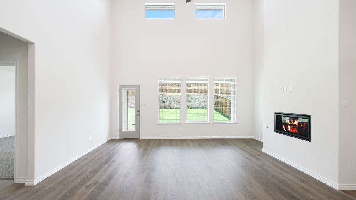 The Burrow is one of our two-story floorplans featured at our Hidden Lakes community in McKinney, TX. The Burrow offers an impressive 2,560 sq. ft. of living space across 4 bedrooms, 3 bathrooms, and a 2-car garage.  As you walk through the long foyer to the open layout of the home, you will find the large kitchen that is open to the spacious family room and dining area. The soaring ceilings in the living room are sure to grab your attention. The kitchen features granite or quartz countertops, decorative tile backsplash, stainless steel appliances and a large kitchen island.  The main bedroom, bedroom 1, is located downstairs and features a large walk in shower and huge walk in closet. Upstairs you will find a large loft that is open to the living room below. Utilize this space as a media room, game room, or home gym.  This home comes included with a professionally designed landscape package and a full irrigation system as well as our Home is Connected® base package that offers devices such as offers devices such as the Amazon Echo Pop, a Video Doorbell, Deako Smart Light Switch, a Honeywell Thermostat, and more.  Images are representative of plan and may vary as built.  Contact us today and find your home at Hidden Lakes.