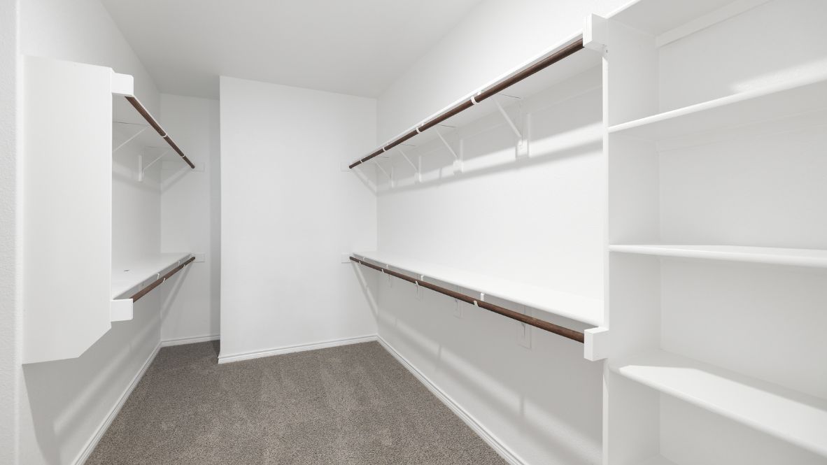 The Burrow is one of our two-story floorplans featured at our Hidden Lakes community in McKinney, TX. The Burrow offers an impressive 2,560 sq. ft. of living space across 4 bedrooms, 3 bathrooms, and a 2-car garage.  As you walk through the long foyer to the open layout of the home, you will find the large kitchen that is open to the spacious family room and dining area. The soaring ceilings in the living room are sure to grab your attention. The kitchen features granite or quartz countertops, decorative tile backsplash, stainless steel appliances and a large kitchen island.  The main bedroom, bedroom 1, is located downstairs and features a large walk in shower and huge walk in closet. Upstairs you will find a large loft that is open to the living room below. Utilize this space as a media room, game room, or home gym.  This home comes included with a professionally designed landscape package and a full irrigation system as well as our Home is Connected® base package that offers devices such as offers devices such as the Amazon Echo Pop, a Video Doorbell, Deako Smart Light Switch, a Honeywell Thermostat, and more.  Images are representative of plan and may vary as built.  Contact us today and find your home at Hidden Lakes.