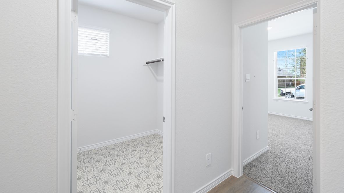 The Burrow is one of our two-story floorplans featured at our Hidden Lakes community in McKinney, TX. The Burrow offers an impressive 2,560 sq. ft. of living space across 4 bedrooms, 3 bathrooms, and a 2-car garage.  As you walk through the long foyer to the open layout of the home, you will find the large kitchen that is open to the spacious family room and dining area. The soaring ceilings in the living room are sure to grab your attention. The kitchen features granite or quartz countertops, decorative tile backsplash, stainless steel appliances and a large kitchen island.  The main bedroom, bedroom 1, is located downstairs and features a large walk in shower and huge walk in closet. Upstairs you will find a large loft that is open to the living room below. Utilize this space as a media room, game room, or home gym.  This home comes included with a professionally designed landscape package and a full irrigation system as well as our Home is Connected® base package that offers devices such as offers devices such as the Amazon Echo Pop, a Video Doorbell, Deako Smart Light Switch, a Honeywell Thermostat, and more.  Images are representative of plan and may vary as built.  Contact us today and find your home at Hidden Lakes.