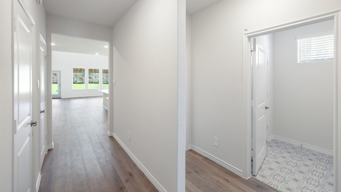 The Burrow is one of our two-story floorplans featured at our Hidden Lakes community in McKinney, TX. The Burrow offers an impressive 2,560 sq. ft. of living space across 4 bedrooms, 3 bathrooms, and a 2-car garage.  As you walk through the long foyer to the open layout of the home, you will find the large kitchen that is open to the spacious family room and dining area. The soaring ceilings in the living room are sure to grab your attention. The kitchen features granite or quartz countertops, decorative tile backsplash, stainless steel appliances and a large kitchen island.  The main bedroom, bedroom 1, is located downstairs and features a large walk in shower and huge walk in closet. Upstairs you will find a large loft that is open to the living room below. Utilize this space as a media room, game room, or home gym.  This home comes included with a professionally designed landscape package and a full irrigation system as well as our Home is Connected® base package that offers devices such as offers devices such as the Amazon Echo Pop, a Video Doorbell, Deako Smart Light Switch, a Honeywell Thermostat, and more.  Images are representative of plan and may vary as built.  Contact us today and find your home at Hidden Lakes.