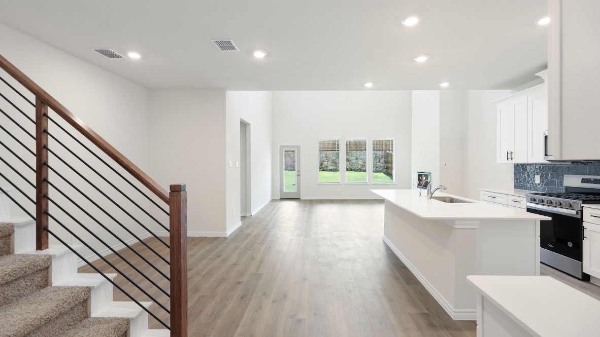 The Burrow is one of our two-story floorplans featured at our Hidden Lakes community in McKinney, TX. The Burrow offers an impressive 2,560 sq. ft. of living space across 4 bedrooms, 3 bathrooms, and a 2-car garage.  As you walk through the long foyer to the open layout of the home, you will find the large kitchen that is open to the spacious family room and dining area. The soaring ceilings in the living room are sure to grab your attention. The kitchen features granite or quartz countertops, decorative tile backsplash, stainless steel appliances and a large kitchen island.  The main bedroom, bedroom 1, is located downstairs and features a large walk in shower and huge walk in closet. Upstairs you will find a large loft that is open to the living room below. Utilize this space as a media room, game room, or home gym.  This home comes included with a professionally designed landscape package and a full irrigation system as well as our Home is Connected® base package that offers devices such as offers devices such as the Amazon Echo Pop, a Video Doorbell, Deako Smart Light Switch, a Honeywell Thermostat, and more.  Images are representative of plan and may vary as built.  Contact us today and find your home at Hidden Lakes.