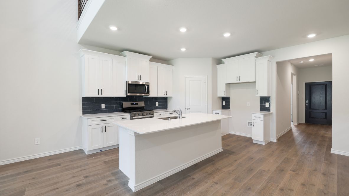 The Burrow is one of our two-story floorplans featured at our Hidden Lakes community in McKinney, TX. The Burrow offers an impressive 2,560 sq. ft. of living space across 4 bedrooms, 3 bathrooms, and a 2-car garage.  As you walk through the long foyer to the open layout of the home, you will find the large kitchen that is open to the spacious family room and dining area. The soaring ceilings in the living room are sure to grab your attention. The kitchen features granite or quartz countertops, decorative tile backsplash, stainless steel appliances and a large kitchen island.  The main bedroom, bedroom 1, is located downstairs and features a large walk in shower and huge walk in closet. Upstairs you will find a large loft that is open to the living room below. Utilize this space as a media room, game room, or home gym.  This home comes included with a professionally designed landscape package and a full irrigation system as well as our Home is Connected® base package that offers devices such as offers devices such as the Amazon Echo Pop, a Video Doorbell, Deako Smart Light Switch, a Honeywell Thermostat, and more.  Images are representative of plan and may vary as built.  Contact us today and find your home at Hidden Lakes.