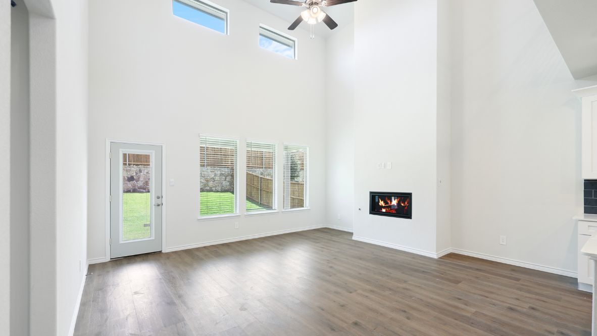 The Burrow is one of our two-story floorplans featured at our Hidden Lakes community in McKinney, TX. The Burrow offers an impressive 2,560 sq. ft. of living space across 4 bedrooms, 3 bathrooms, and a 2-car garage.  As you walk through the long foyer to the open layout of the home, you will find the large kitchen that is open to the spacious family room and dining area. The soaring ceilings in the living room are sure to grab your attention. The kitchen features granite or quartz countertops, decorative tile backsplash, stainless steel appliances and a large kitchen island.  The main bedroom, bedroom 1, is located downstairs and features a large walk in shower and huge walk in closet. Upstairs you will find a large loft that is open to the living room below. Utilize this space as a media room, game room, or home gym.  This home comes included with a professionally designed landscape package and a full irrigation system as well as our Home is Connected® base package that offers devices such as offers devices such as the Amazon Echo Pop, a Video Doorbell, Deako Smart Light Switch, a Honeywell Thermostat, and more.  Images are representative of plan and may vary as built.  Contact us today and find your home at Hidden Lakes.