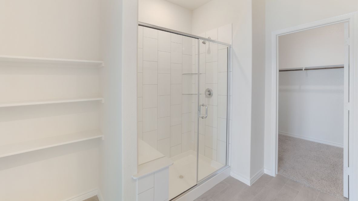 The primary suite, nestled on the main floor, offers a quiet sanctuary. With its walk-in closet and a spa-like ensuite bathroom featuring a double vanity and walk-in shower, perfect to unwinding after a long day.